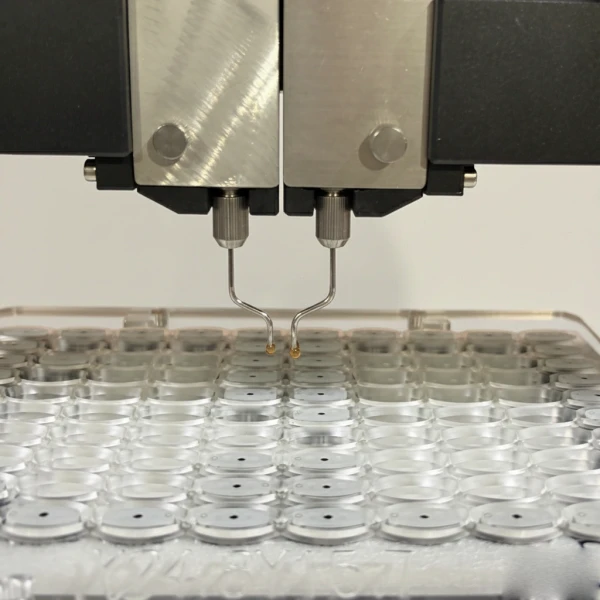 Precision filling needles dosing amber live resin concentrate into glass 510 cartridges
