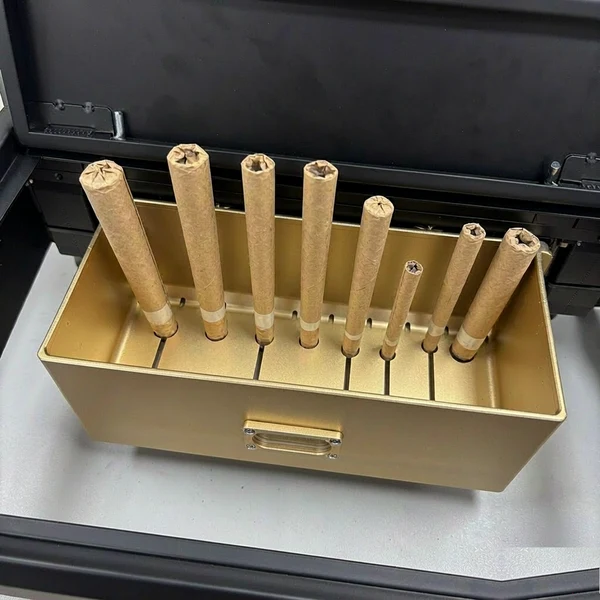 Pre-roll cones of different formats seated in a precision tray fixture